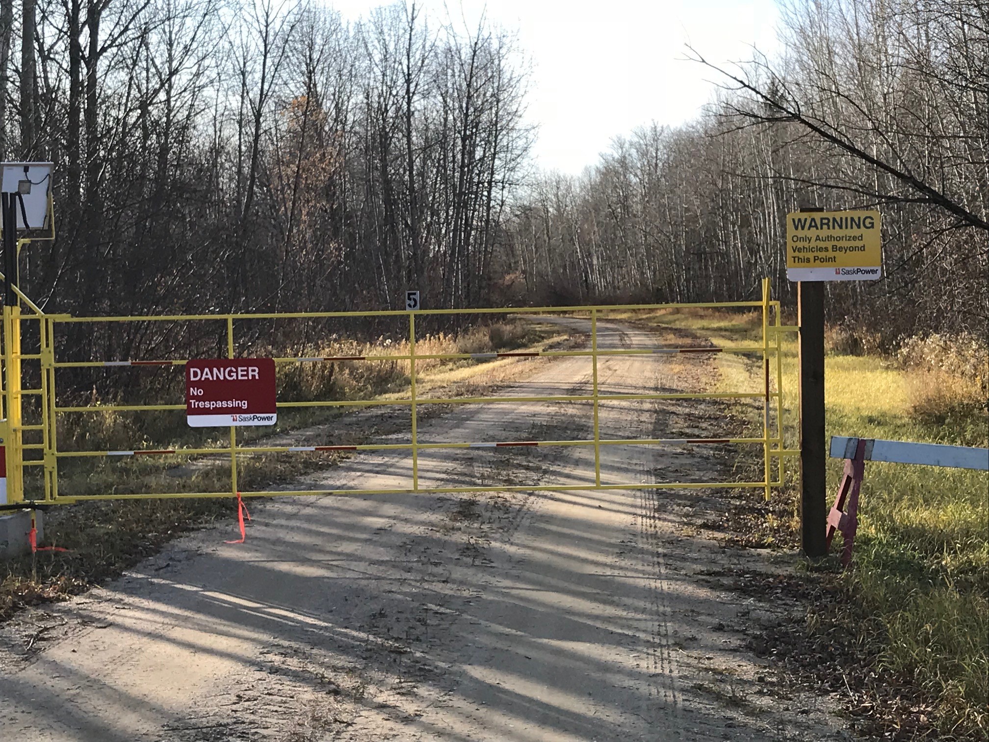 An MJ Endeavors solar powered security gate providing access control at a Sask Power dam.